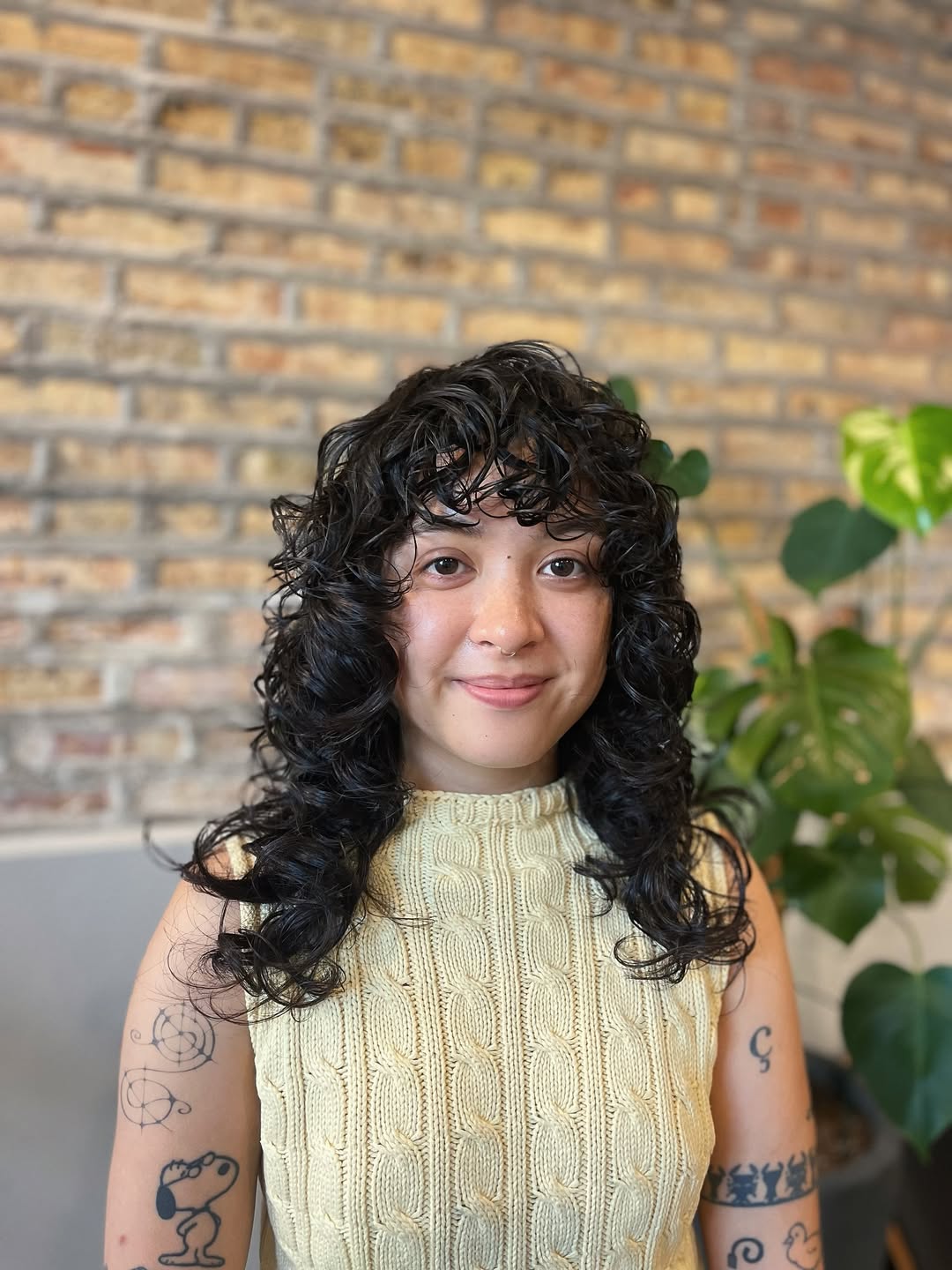 Bouncy Natural Curls with Luminous Black Tones wolf cut hair