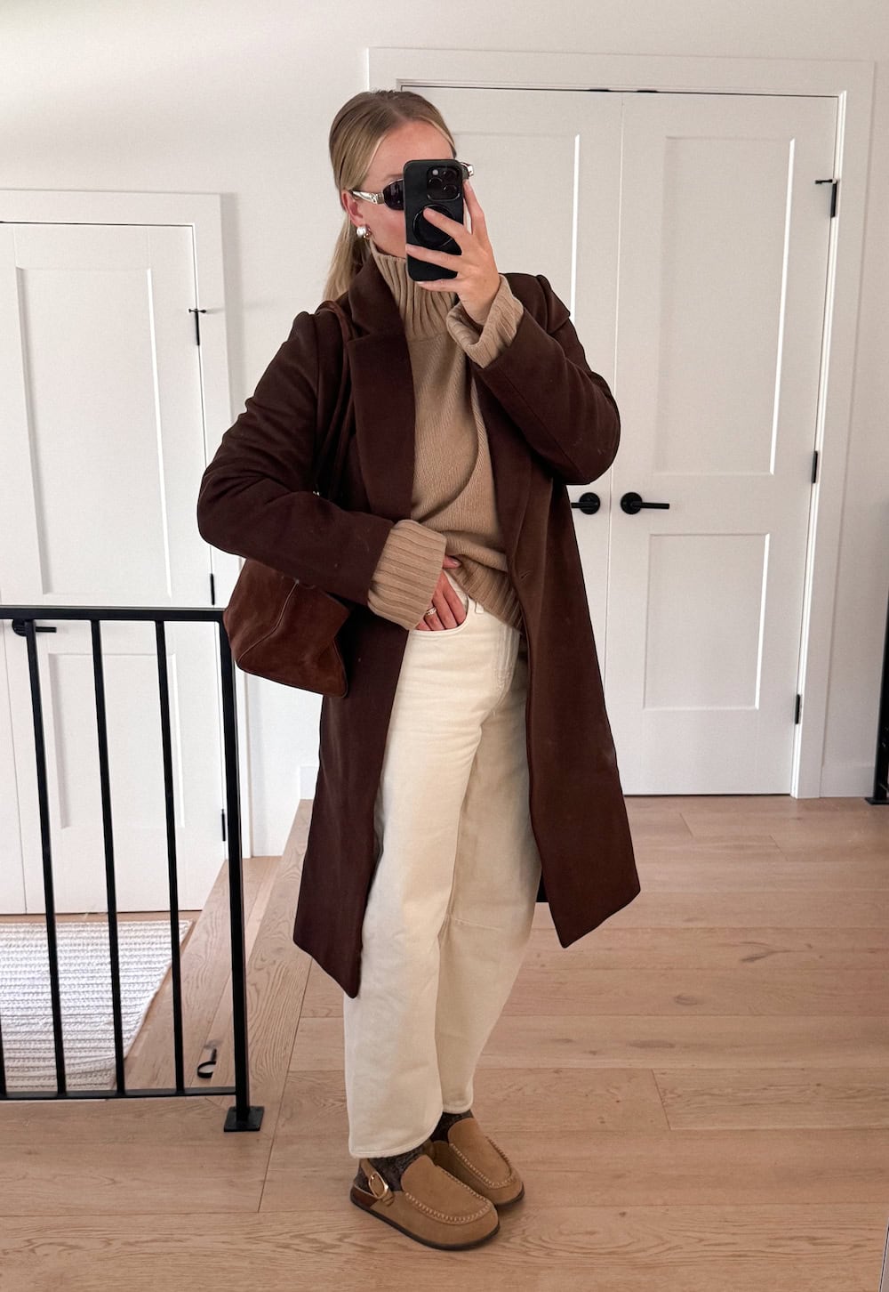 Long chocolate wool coat with camel turtleneck and cream barrel jeans brown outfit