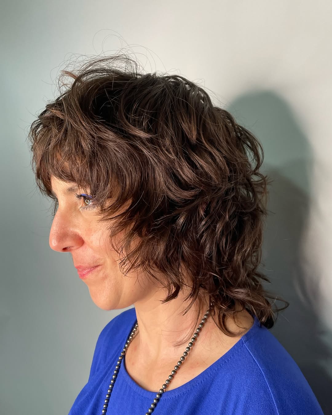 Captivating Curly Shag with Lush Volume wolf cut hair