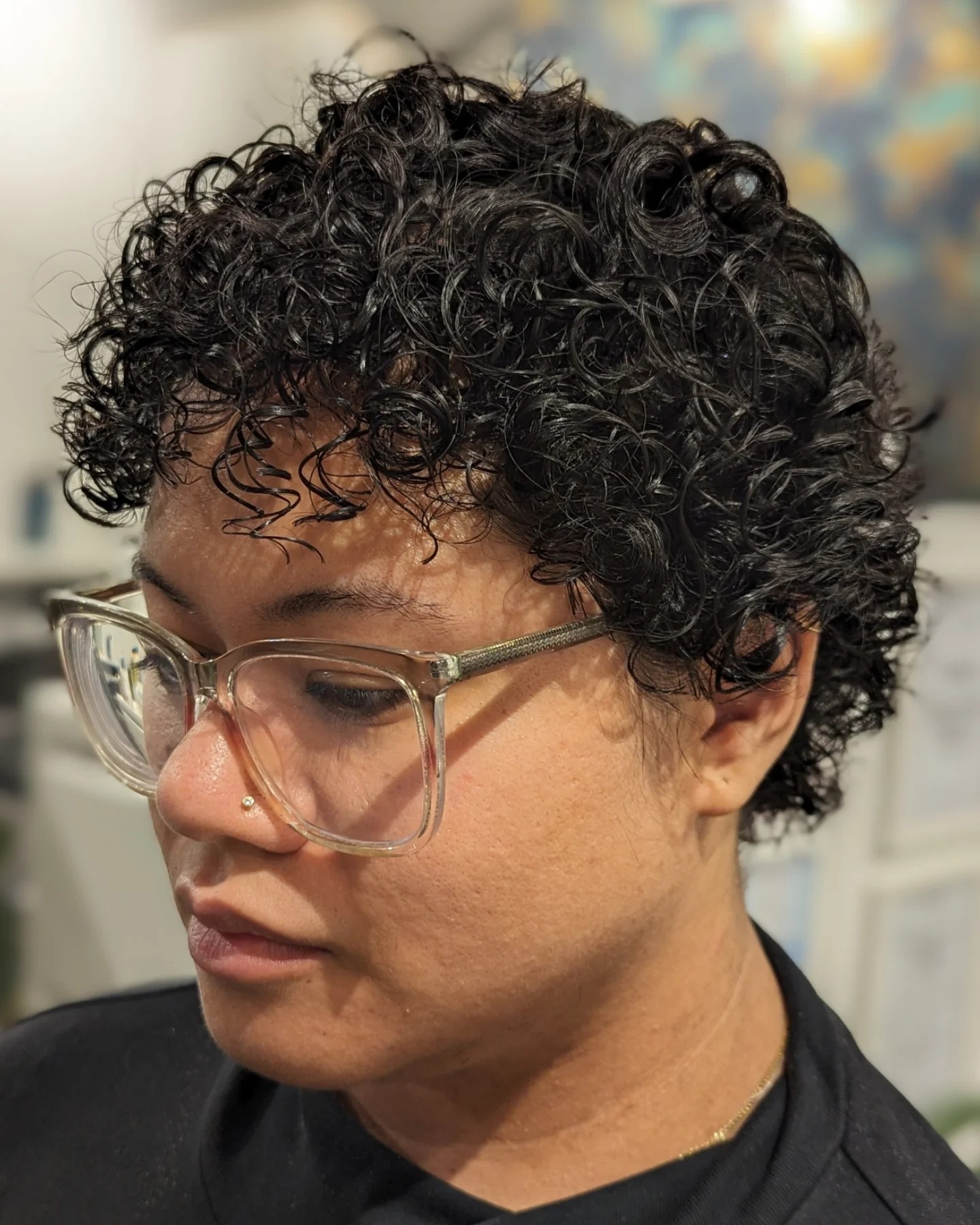 Jet black coily bob with rounded shape
