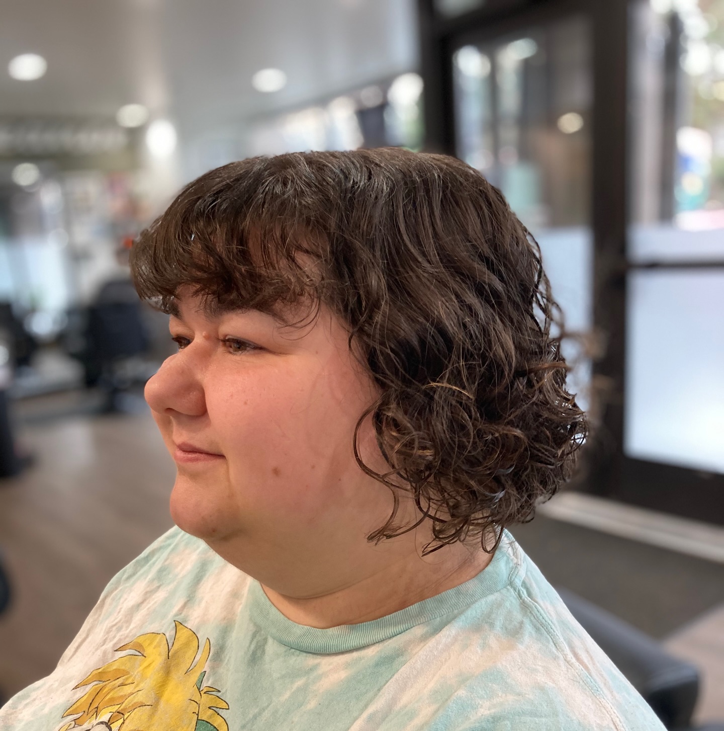 Cascading chestnut curls with soft fringe