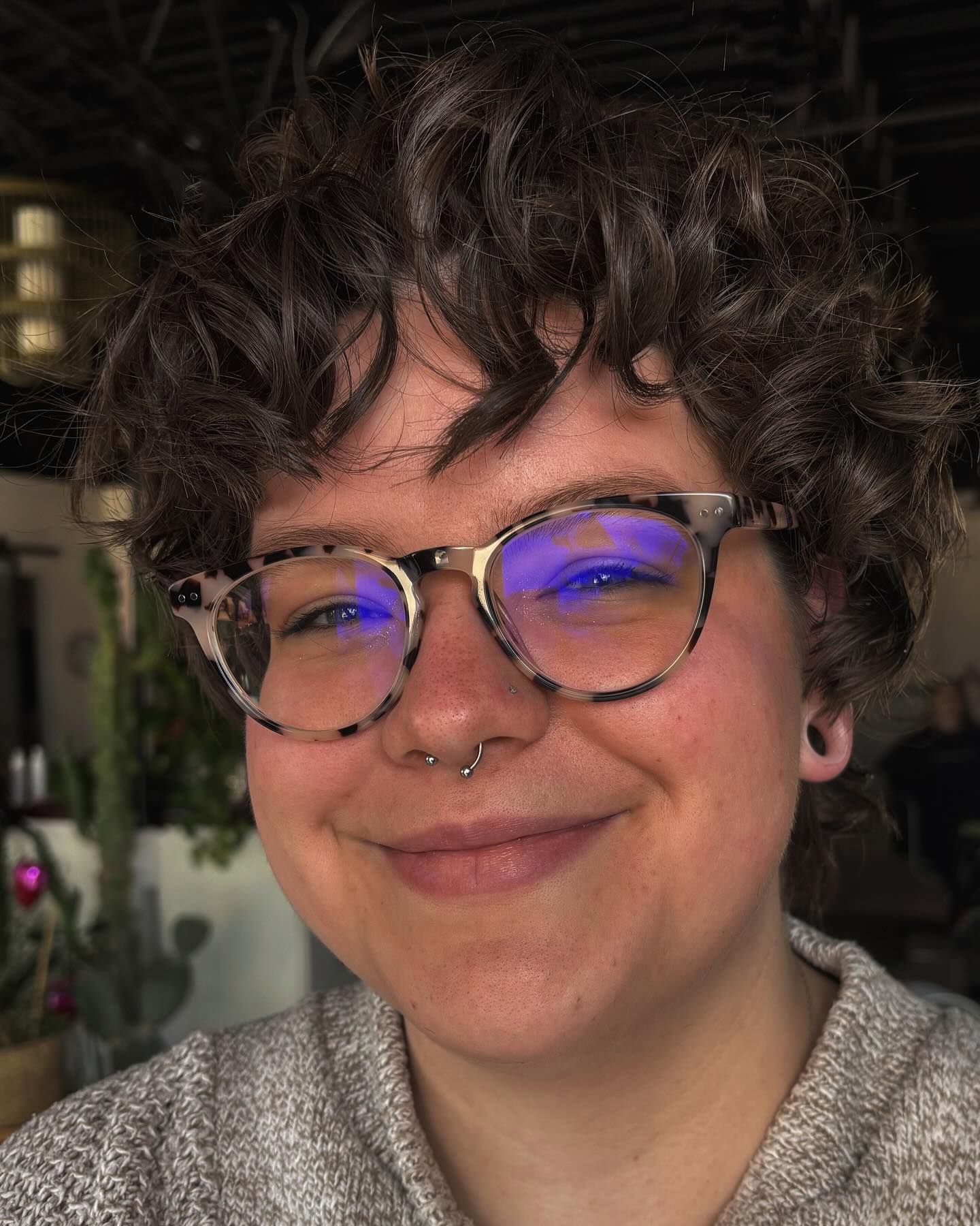 Espresso curly hair with asymmetrical bangs