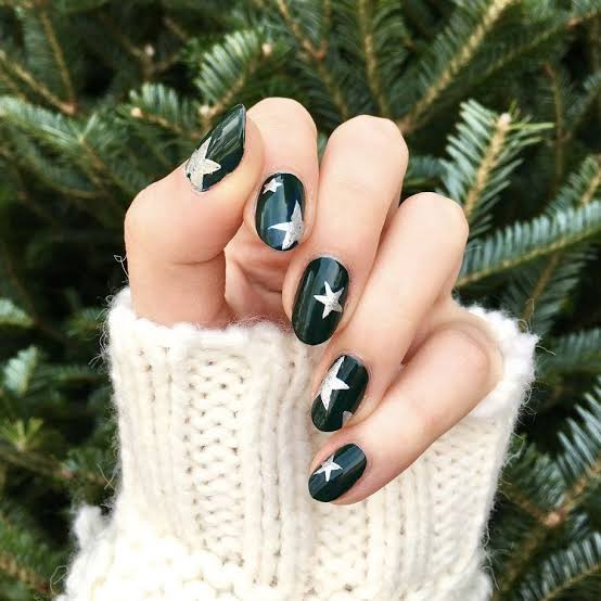 Dark Green Nails with Silver Star Decals holiday nail design