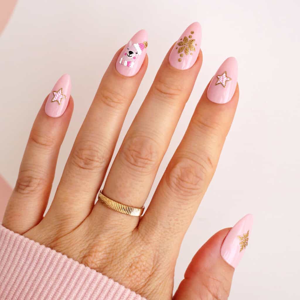 Pale Pink Nails with a Bear, Snowflakes and Gold Stars holiday nail design