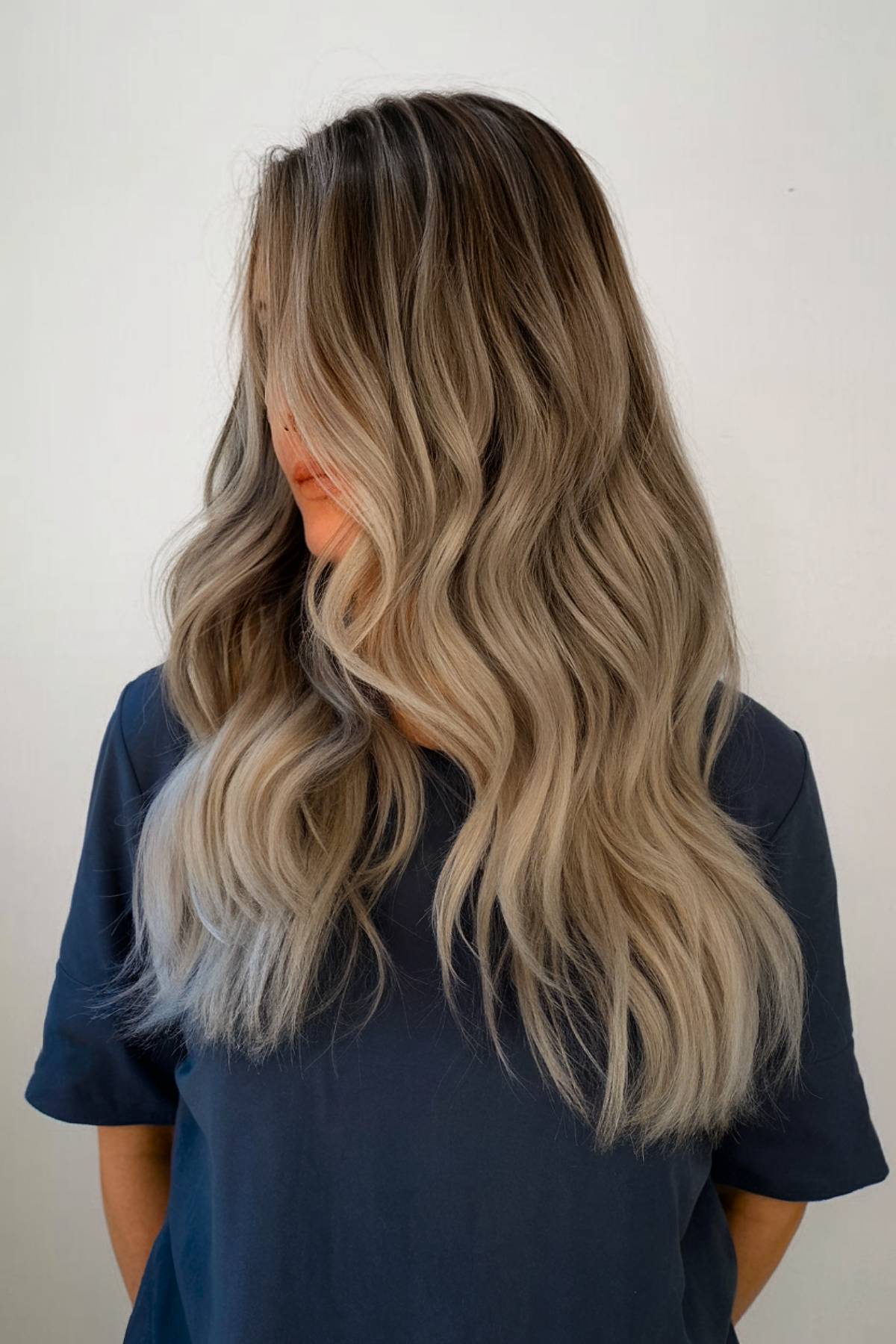 Cool brown hair with ash blonde balayage and long waves