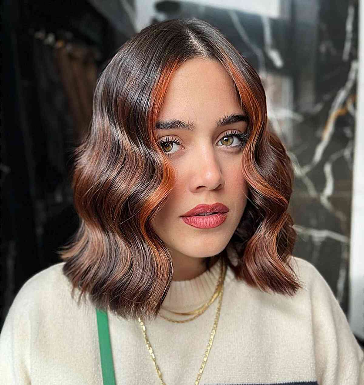 Hazelnut highlight tones on a dark brunette long bob