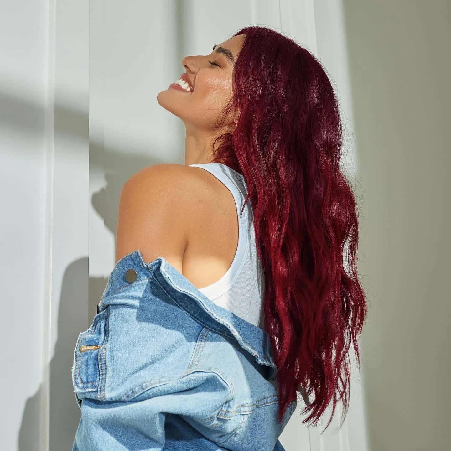 Deep wine burgundy hair with a glossy finish