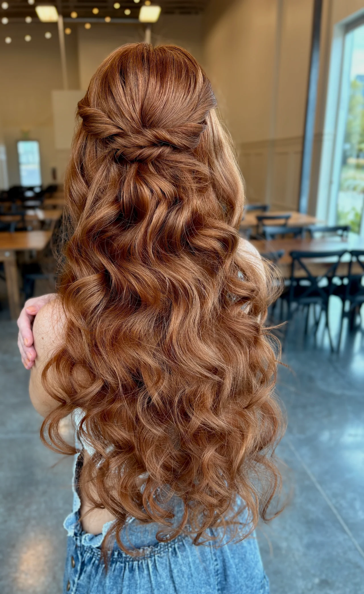 Copper brown hair in a half up hairstyle