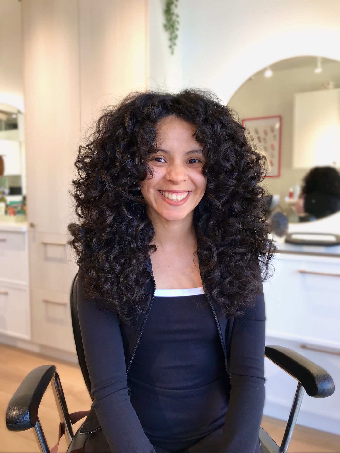 Full bouncy medium-length layered curls