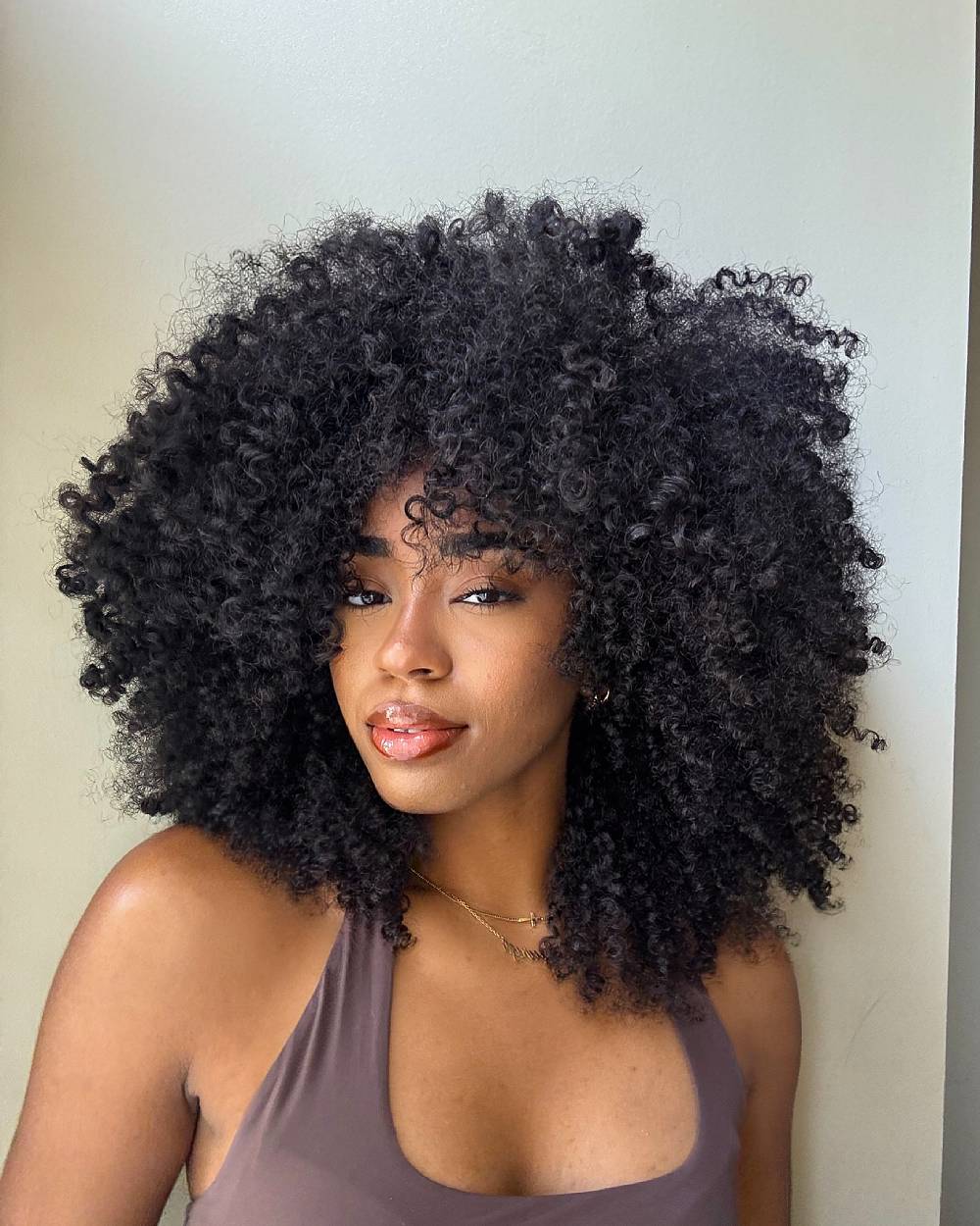 Layered curly afro shape with full volume