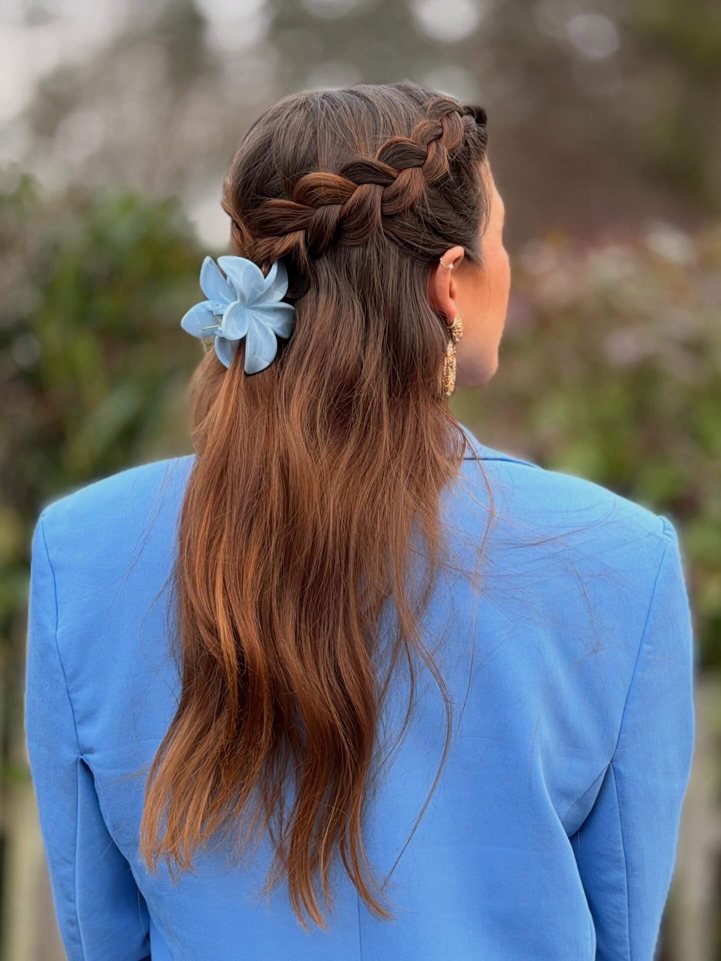 Half-Up Braided Style with a Floral Accent hairstyle