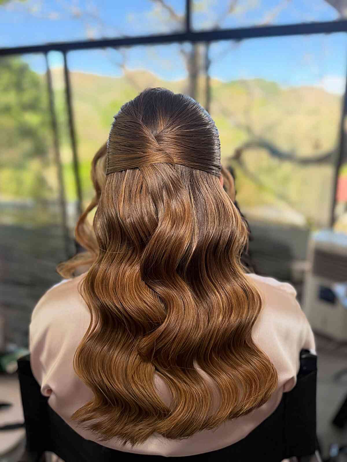 Half-Up Waves with a Soft Twisted Crown hairstyle