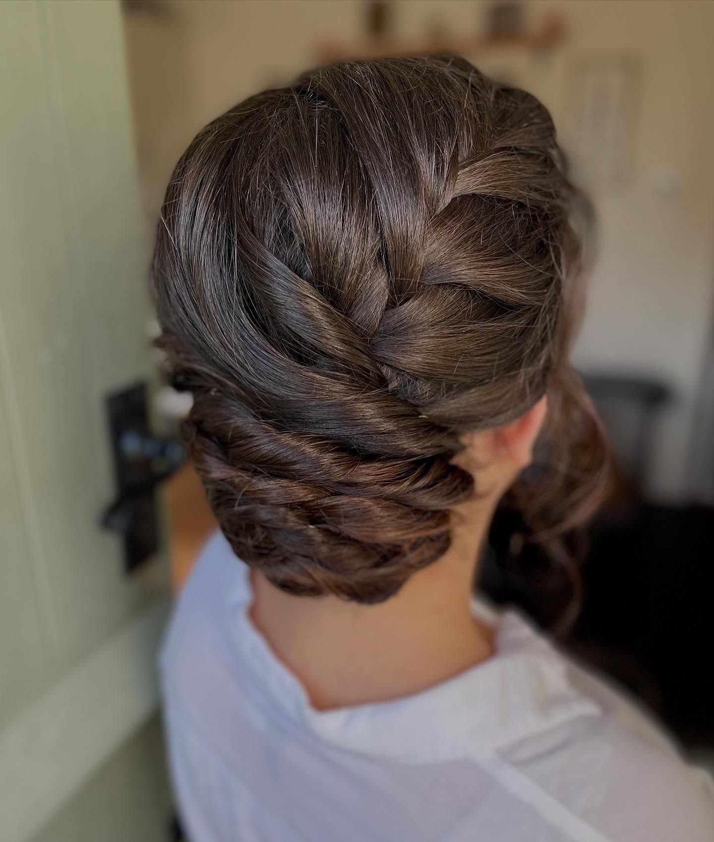 Elegant Dark Brown Twist Updo with Face-Framing Pieces twist updo hairstyle