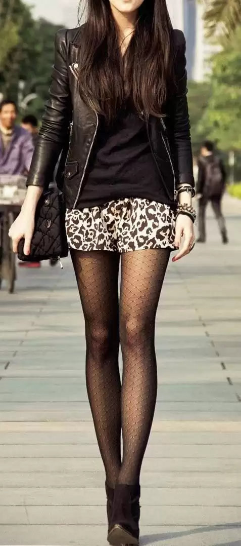 A Leopard Mini With a Moto Jacket and Patterned Tights edgy outfit