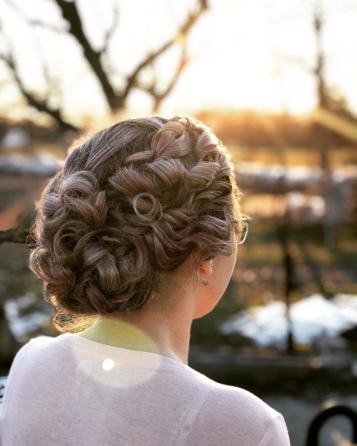 Formal curly updo with a polished finish