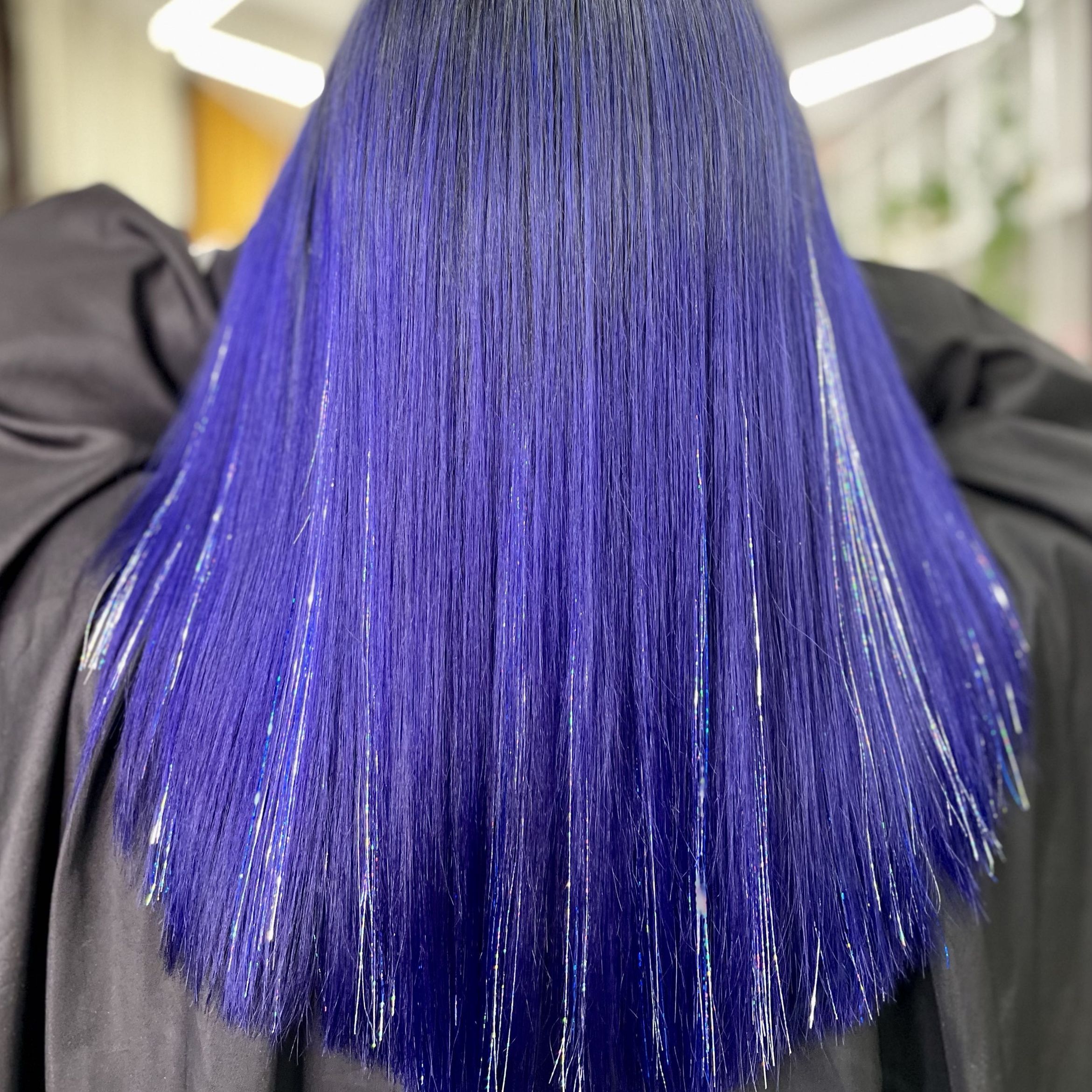 Midnight blue hair with silver tinsel strands