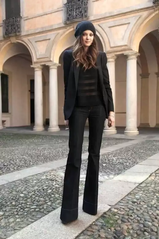 All-Black Blazer Look with a Sheer Striped Top and Beanie black flare jeans outfit
