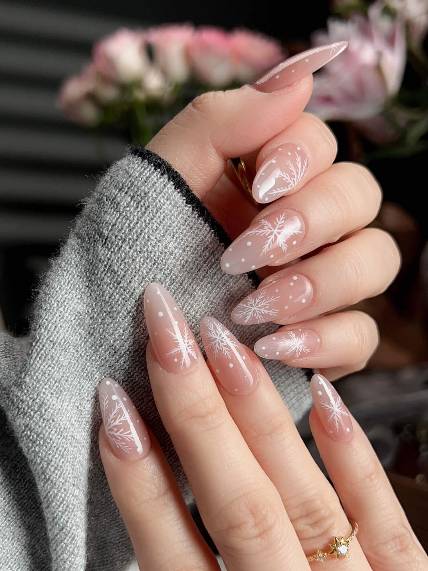 Milky Almonds with White Snowflakes subtle Christmas nail design
