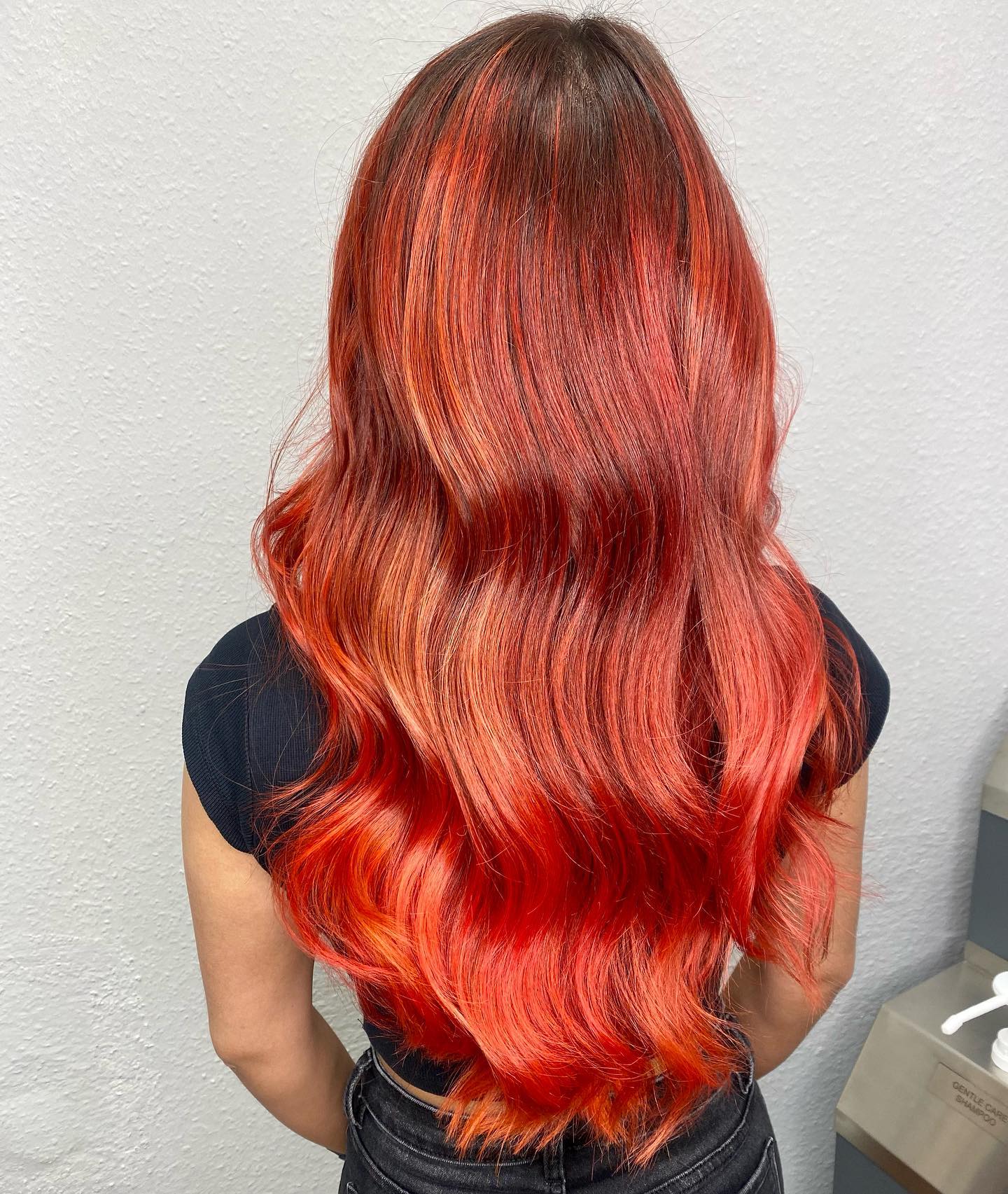 Flame orange to red ombre on long hair