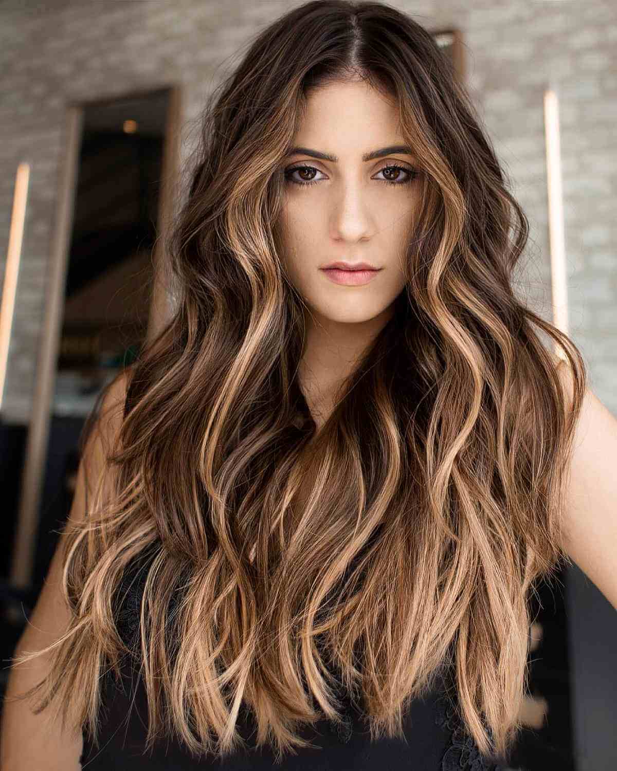 Long layers in medium brown with blonde balayage