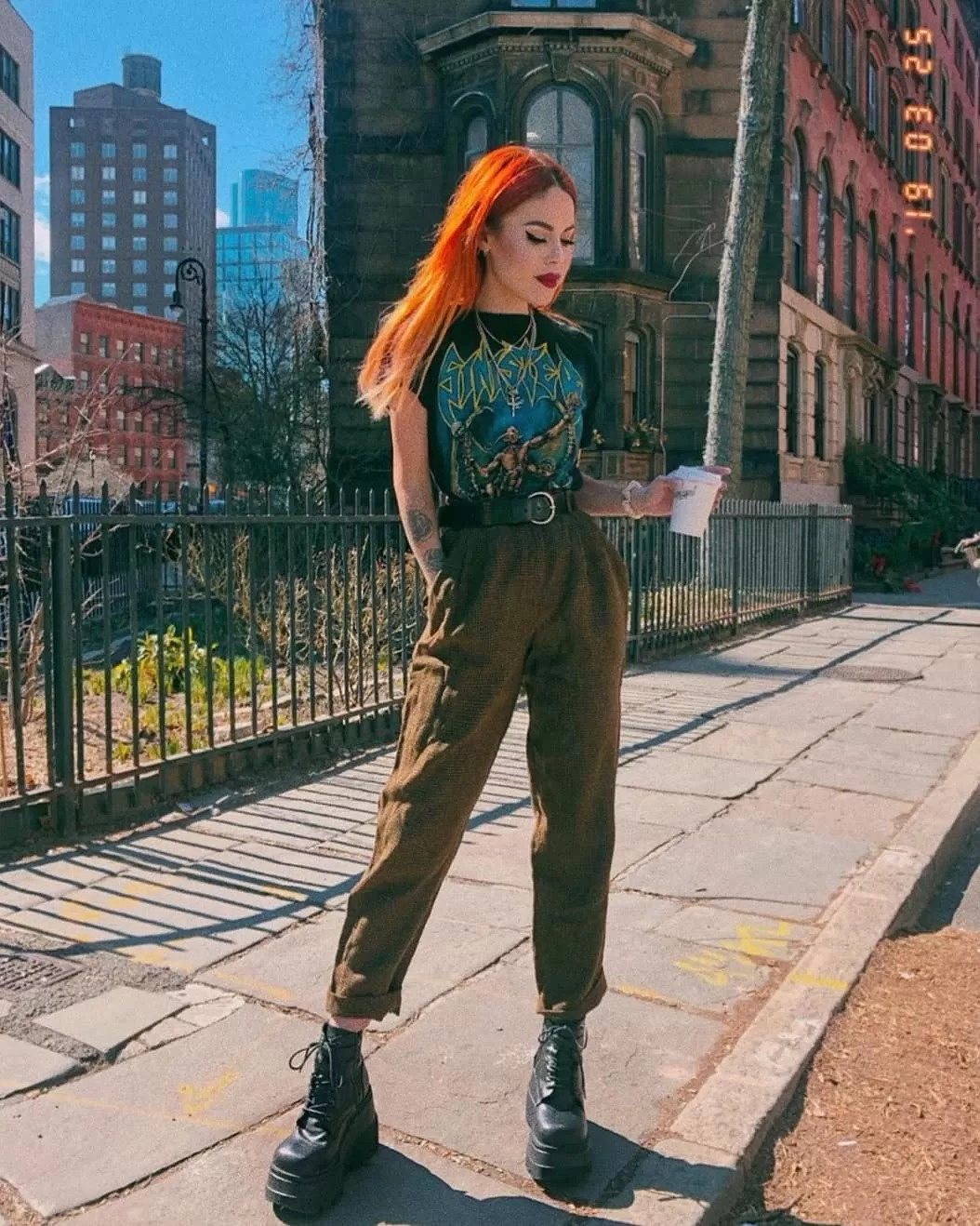 A Band Tee Tucked Into Wide-Leg Trousers edgy outfit
