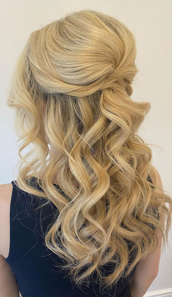 Voluminous curled half-up half-down hairstyle