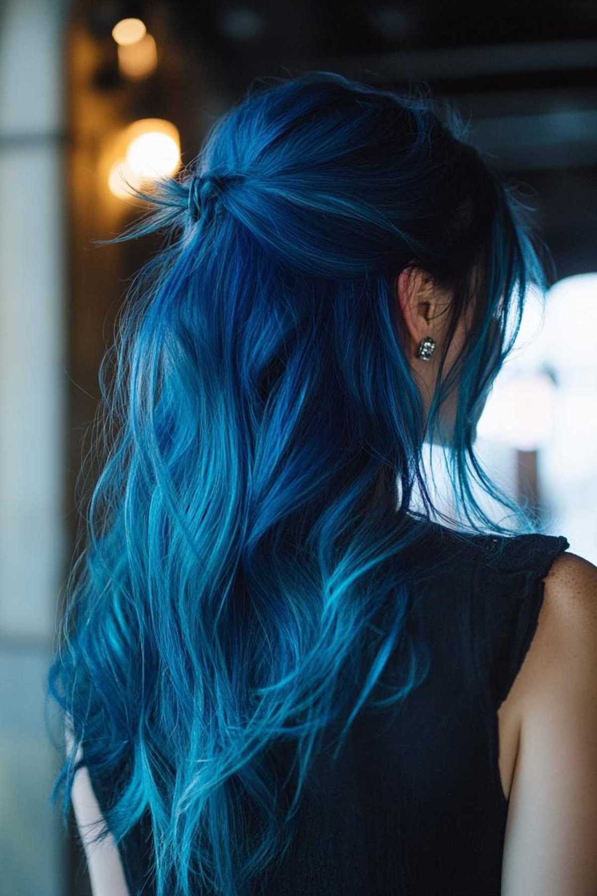 Blue Waves With Platinum Lights, Swept Into a Ponytail winter hair trend