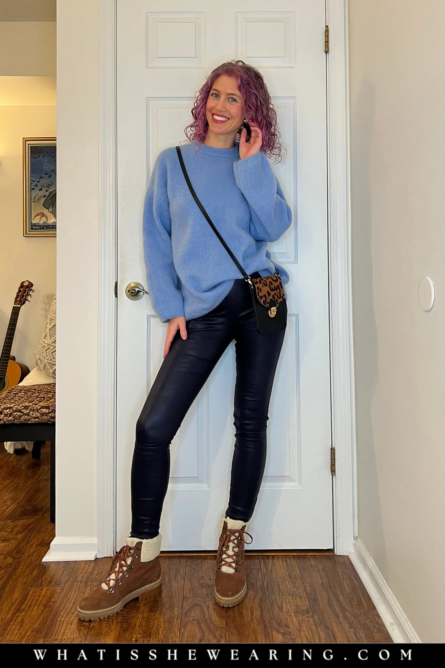 Oversized sweater and shearling boots with leather leggings