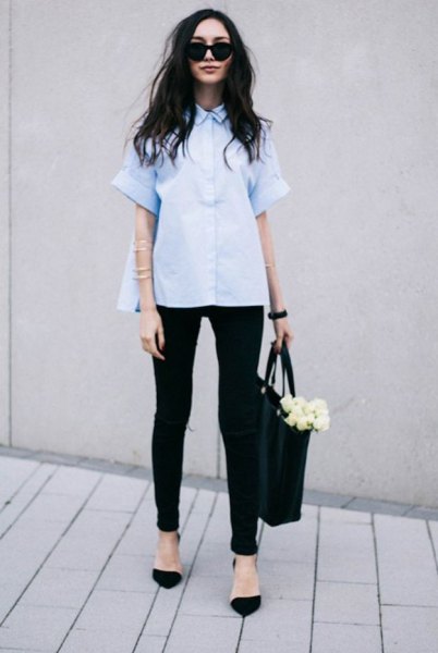 Light blue short-sleeve button-up blouse with black skinny jeans blue top outfit