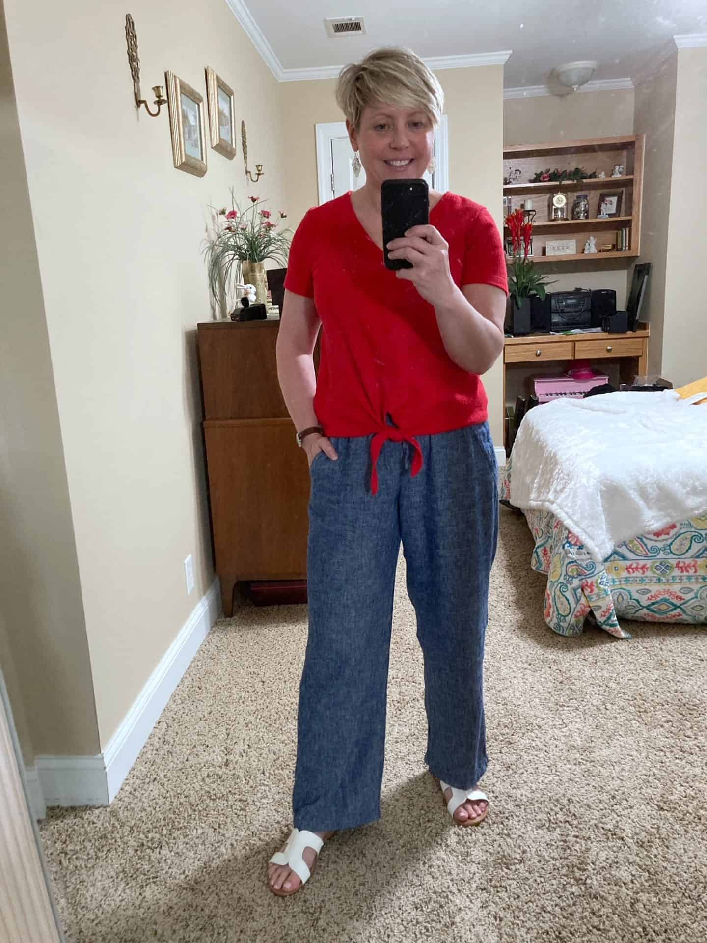 Red tie-front top with blue linen pants and white slide sandals linen pants outfit