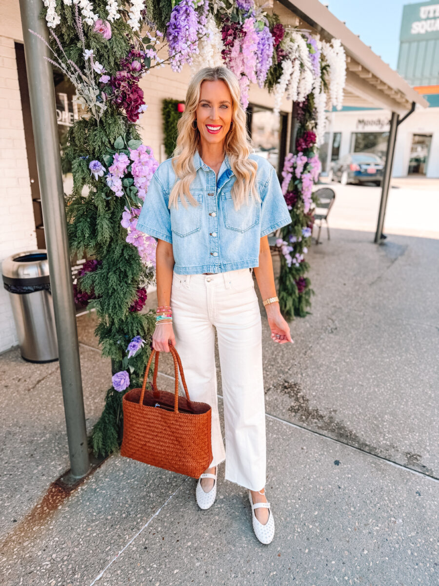 Woman wearing a cropped denim top with cream wide-leg jeans