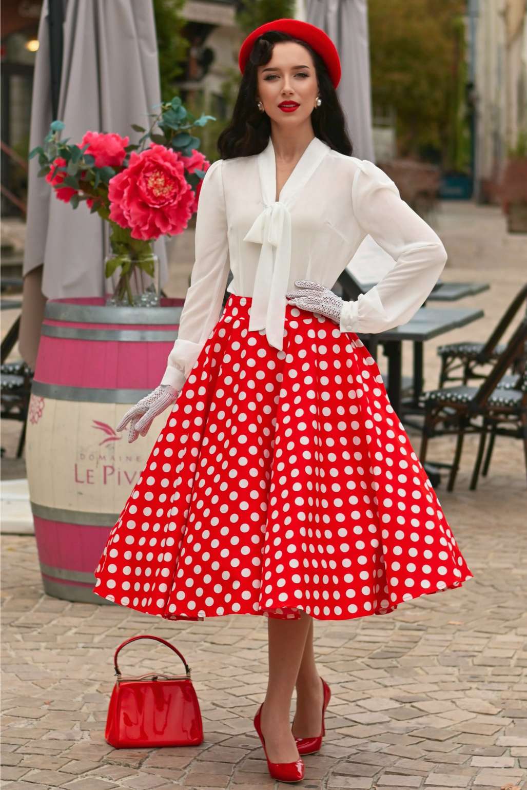 Red polka dot full-circle midi skirt worn with a simple top