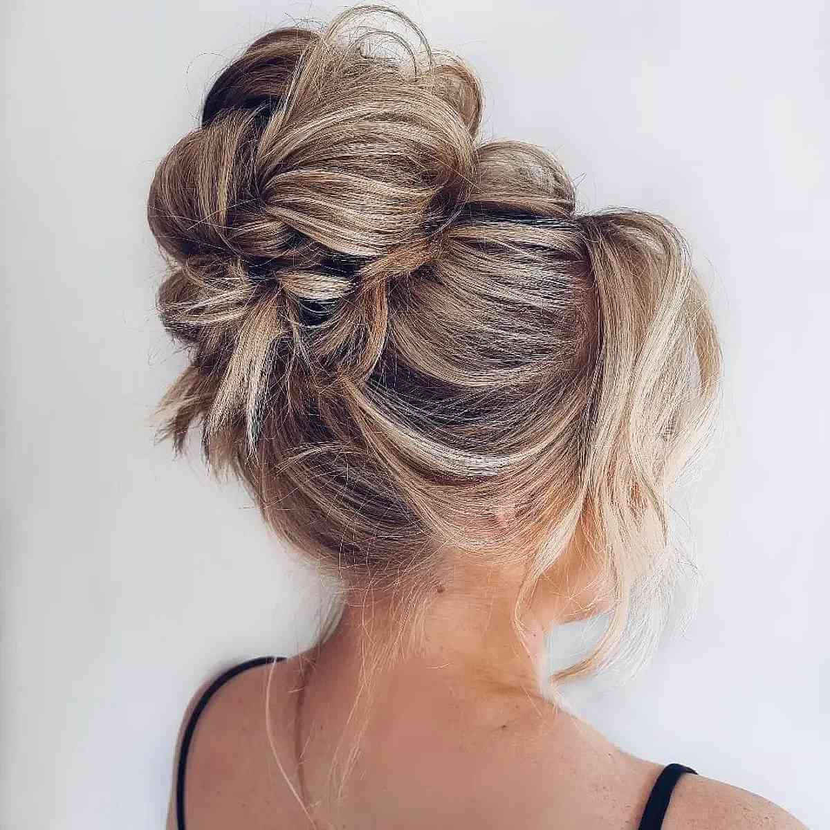 Messy Blonde High Bun Updo hairstyle