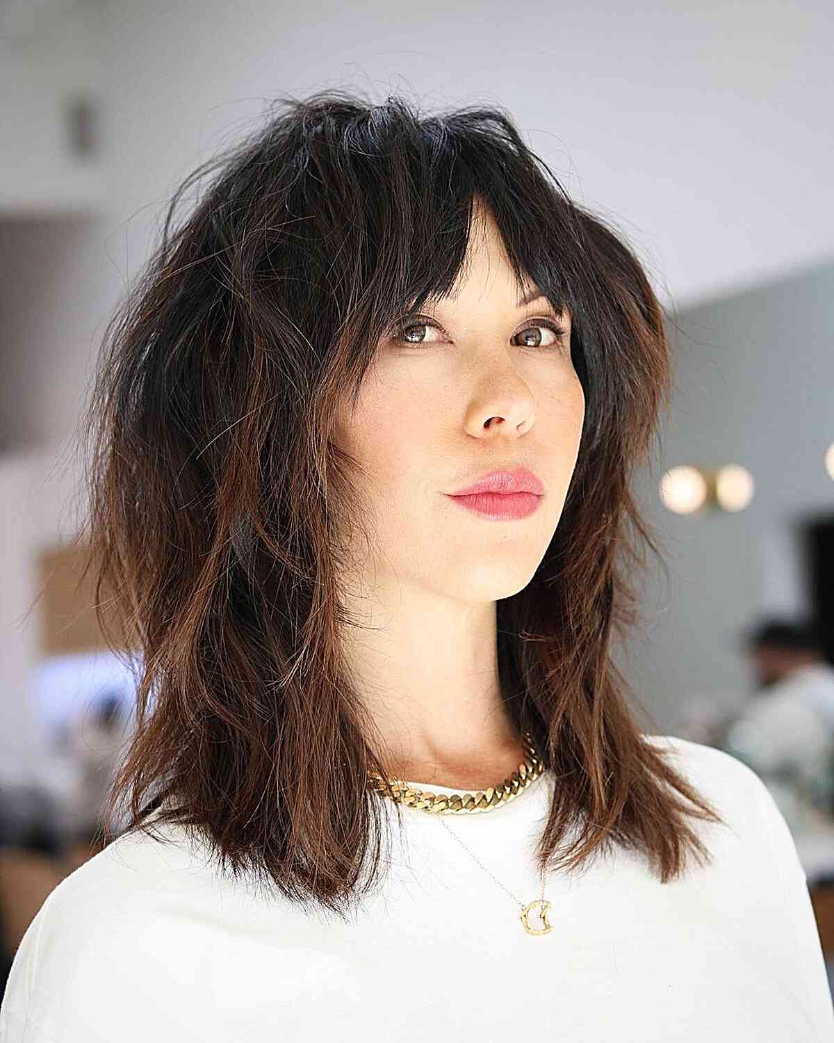 Mid-length shag haircut with blended layers