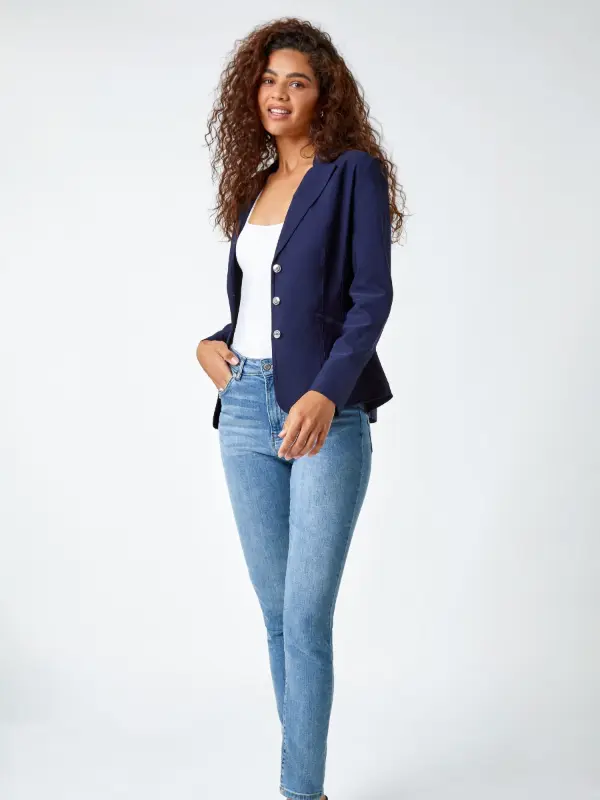 Navy blazer with a white tank and light skinny jeans