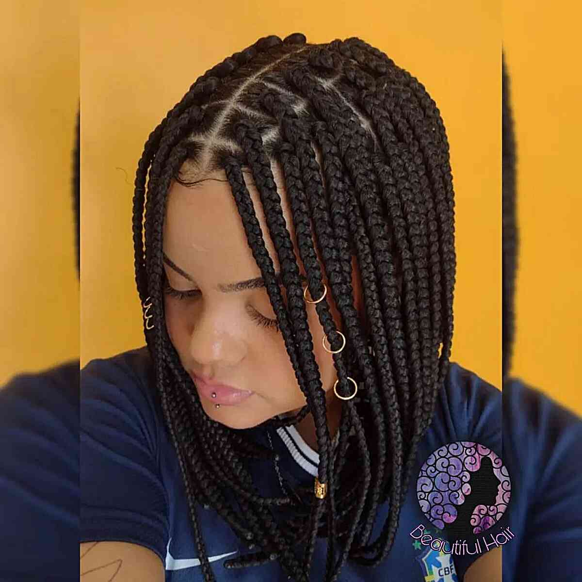 Neat box braids with rings and cuffs hairstyle