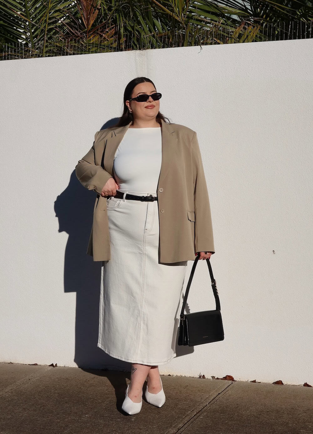 Cream blazer over a white midi skirt work outfit