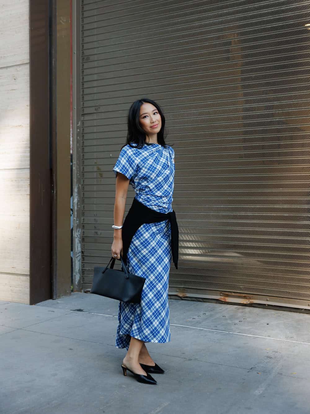 Blue and white plaid midi dress with a black sweater work outfit