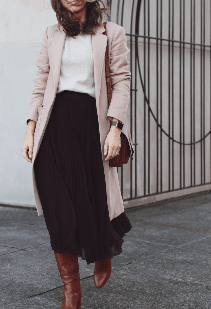 Pleated midi skirt with knit and brown boots job interview outfit