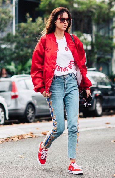 Red bomber jacket, white graphic tee and embroidered mom jeans t-shirt outfit