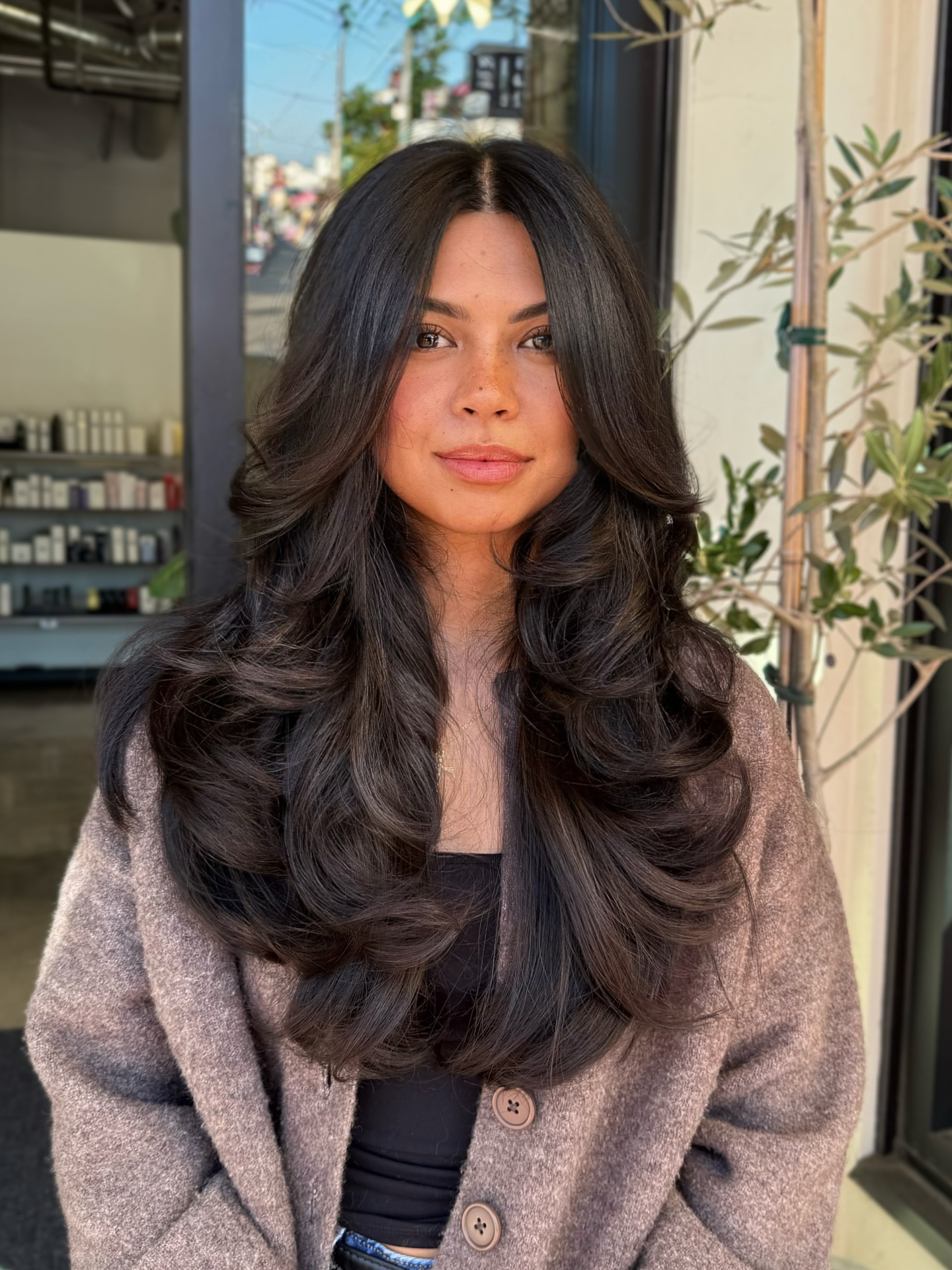 Rich Chestnut Waves with Soft Curtain Bangs face framing bangs hairstyle