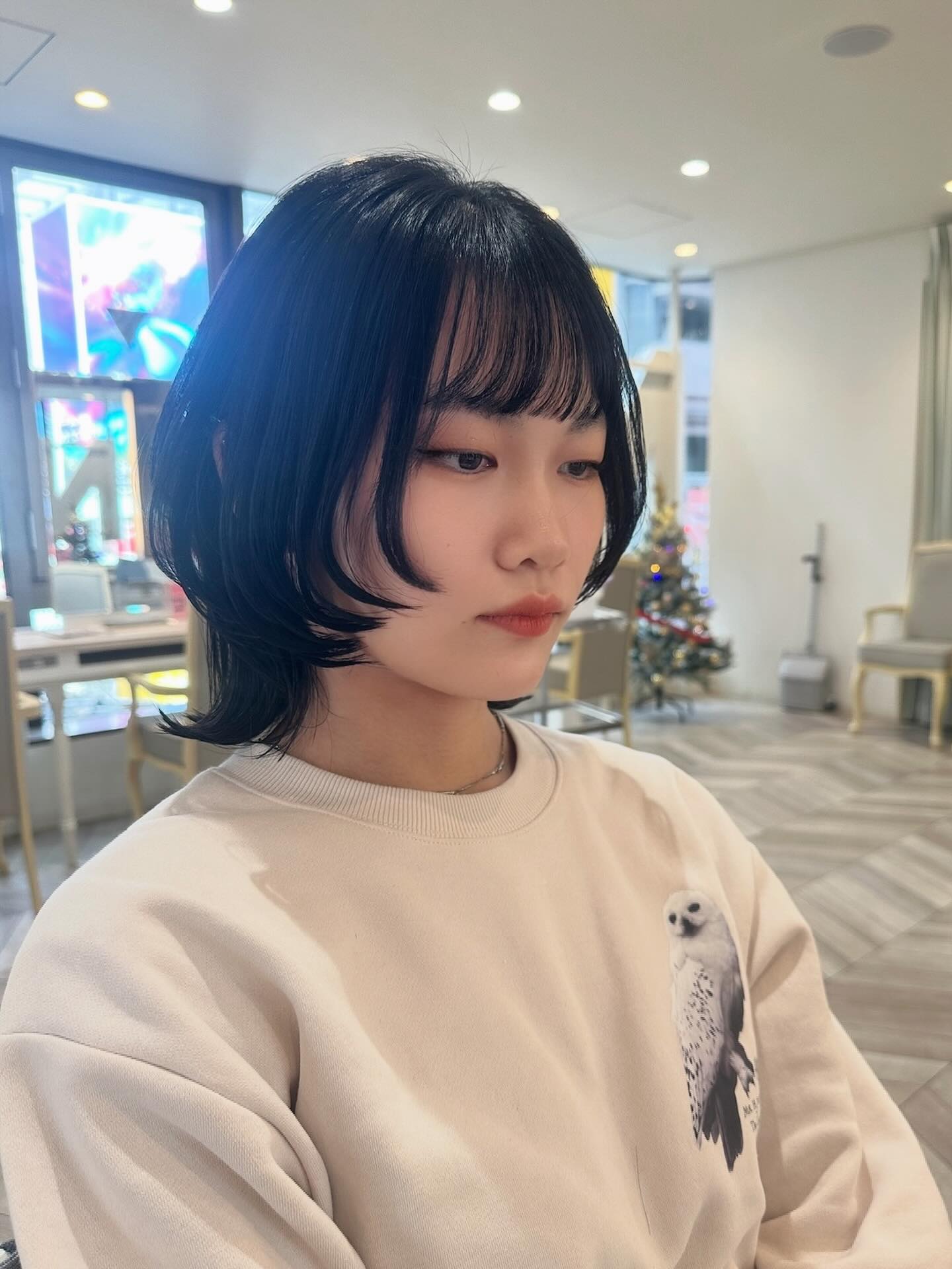 Rounded short wolf cut with feathered micro bangs