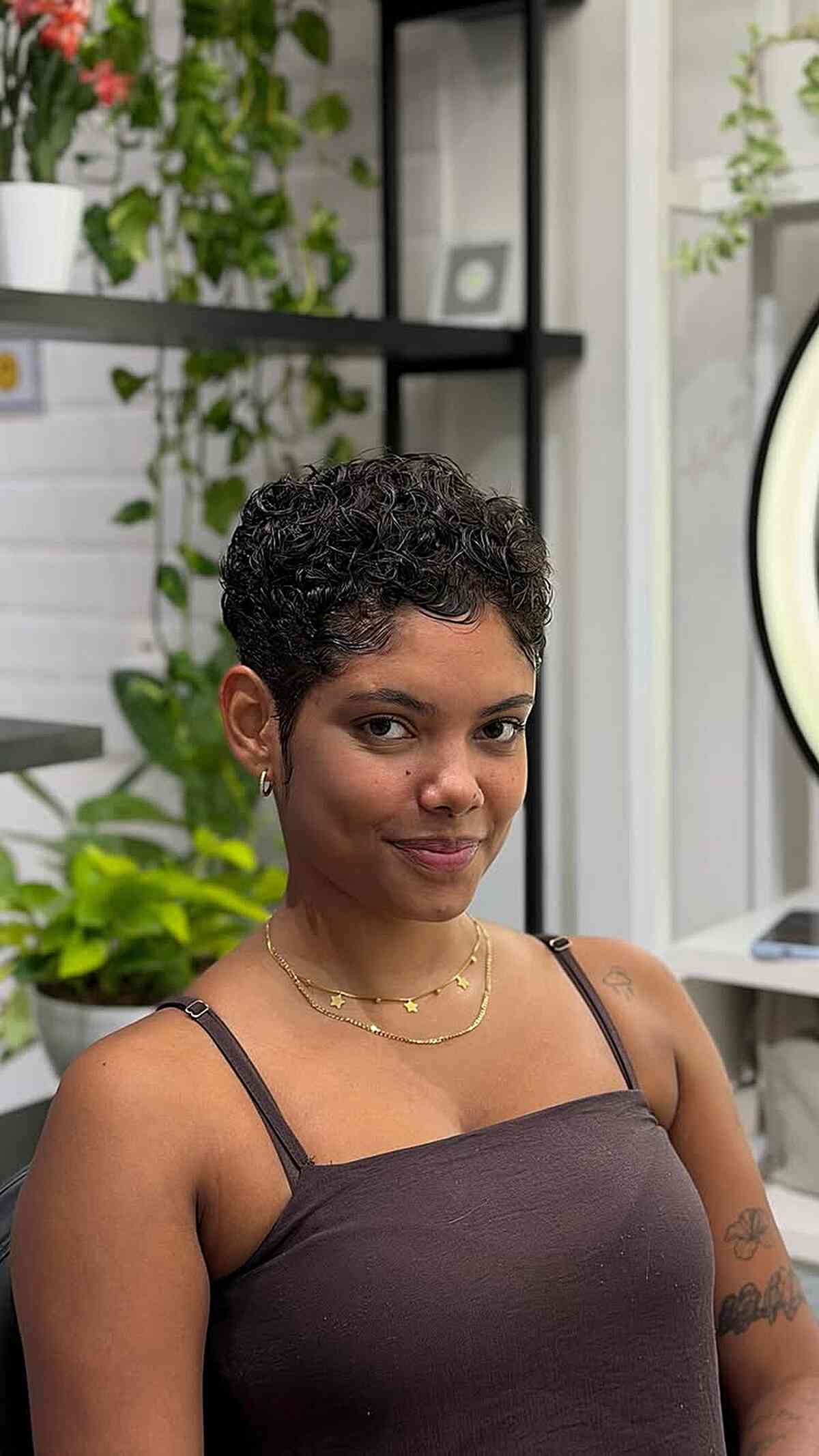 Sculpted curl pixie with a waved fringe short hair hairstyle