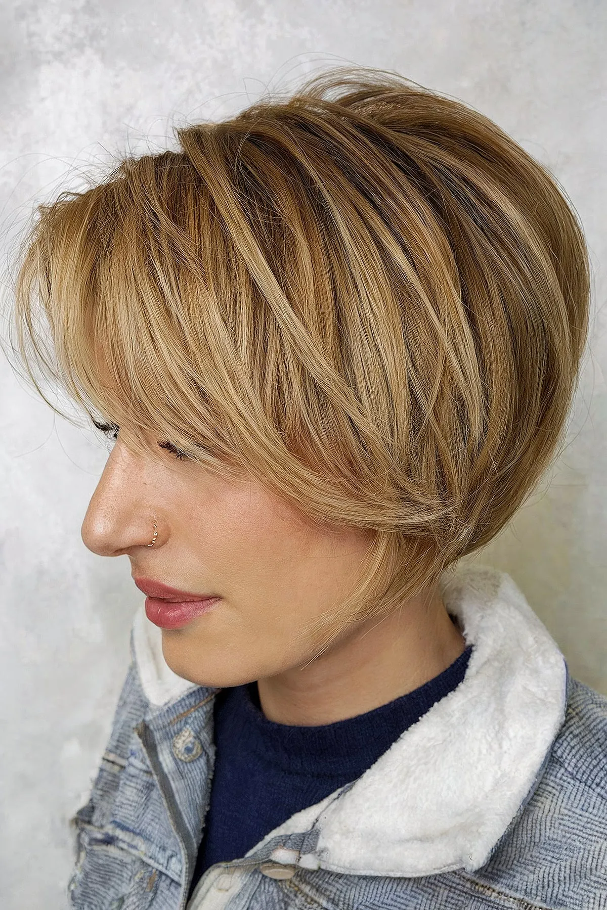 Short Blonde Stacked Bob with Side Bangs stacked bob haircut