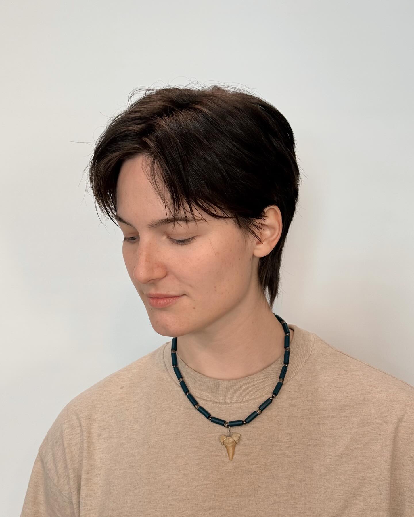 Short wolf cut with curtain bangs and disconnected nape