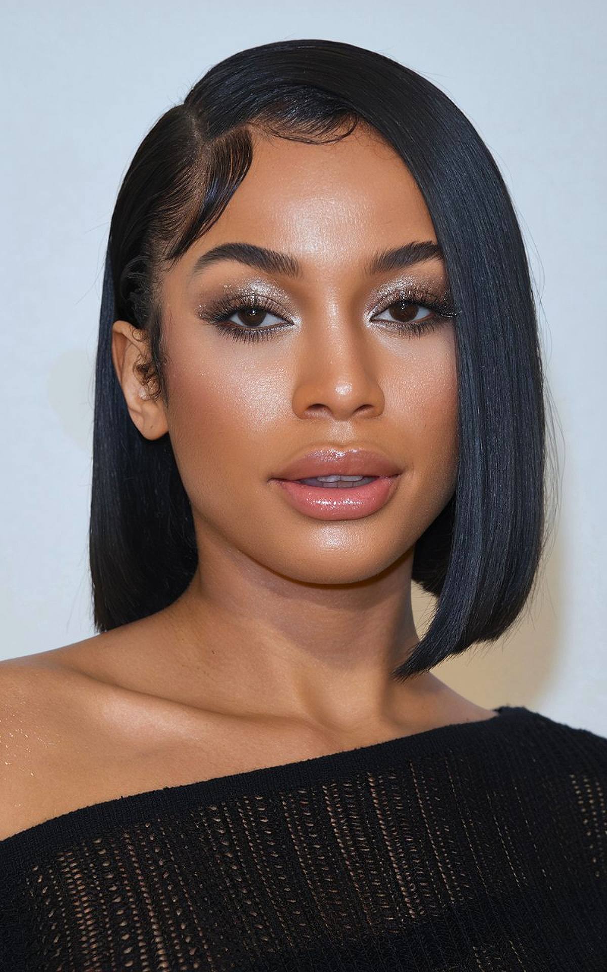 Side-part bob with a longer sweep on one side silk press hairstyle