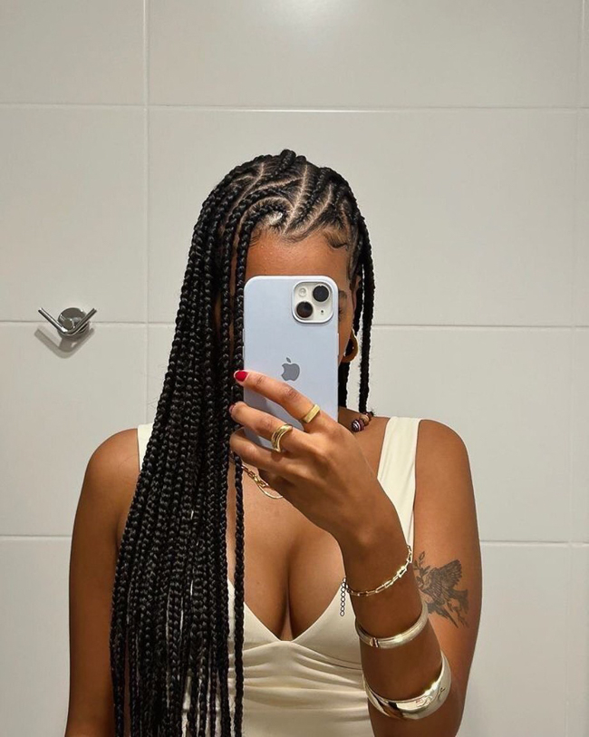 Side-Swept Fulani Braids Falling Over One Shoulder Fulani braids hairstyle