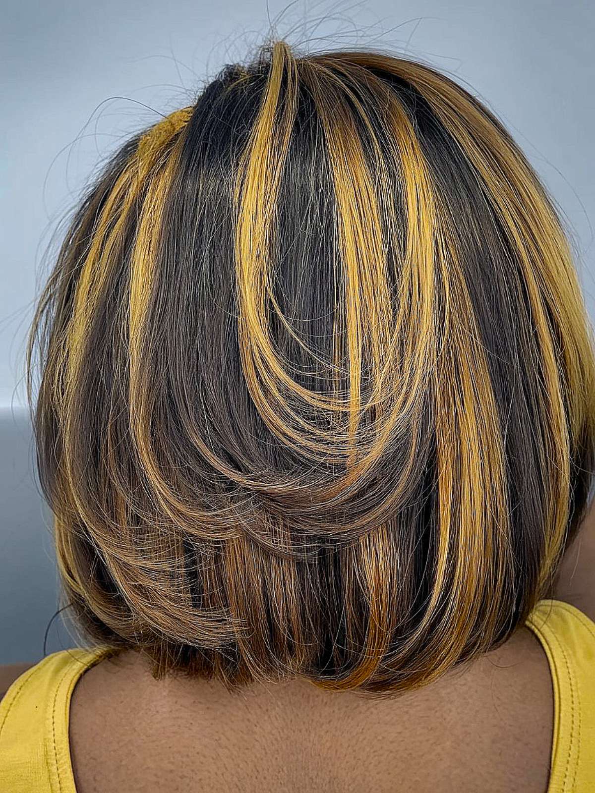 Bob with warm golden highlights silk press hairstyle