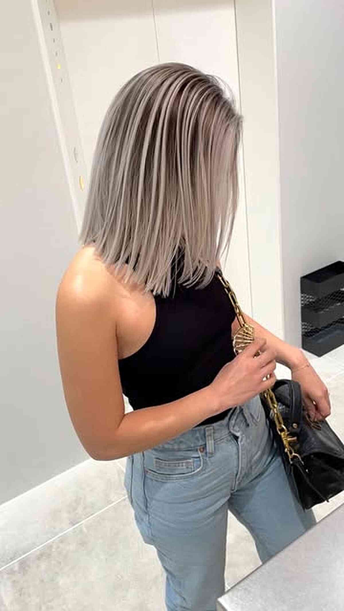 Silver-beige blunt middle part bob haircut