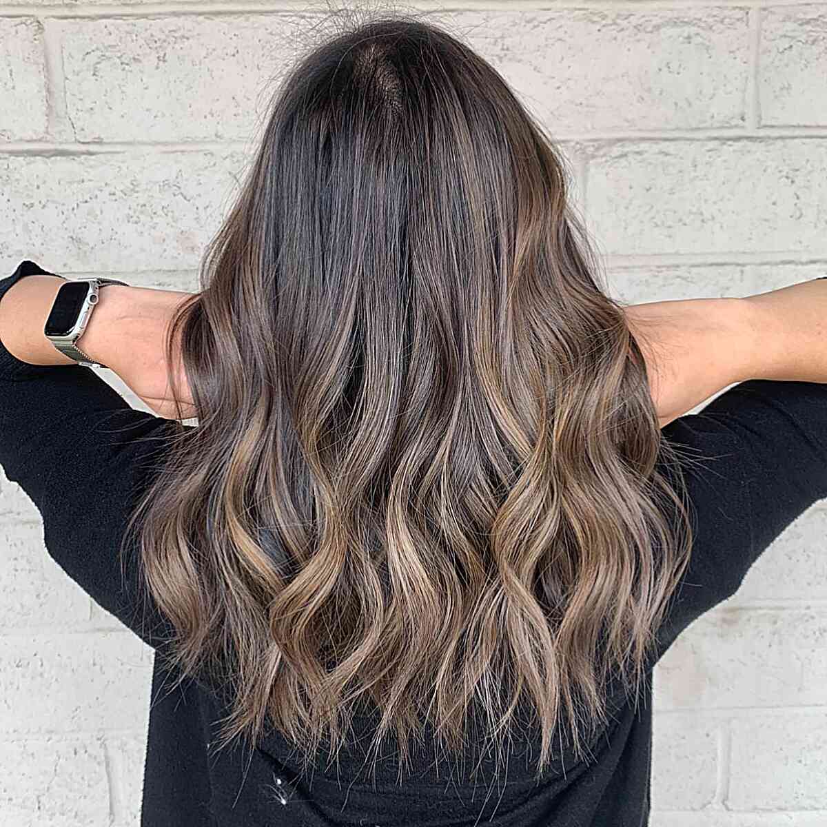 Soft ash brown ombre on long hair with choppy ends